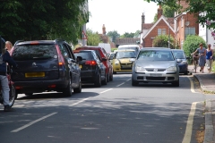 East Street - Outside Tollesbury School traffic builds up  due to parked cars and the narrow gap  further along  East Street.