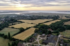 Sunrise over Tollesbury - Taken from The Victory Recreation Ground, Tollesbury. The triangular shaped field in the centre of the photograph is the area for the proposed development.